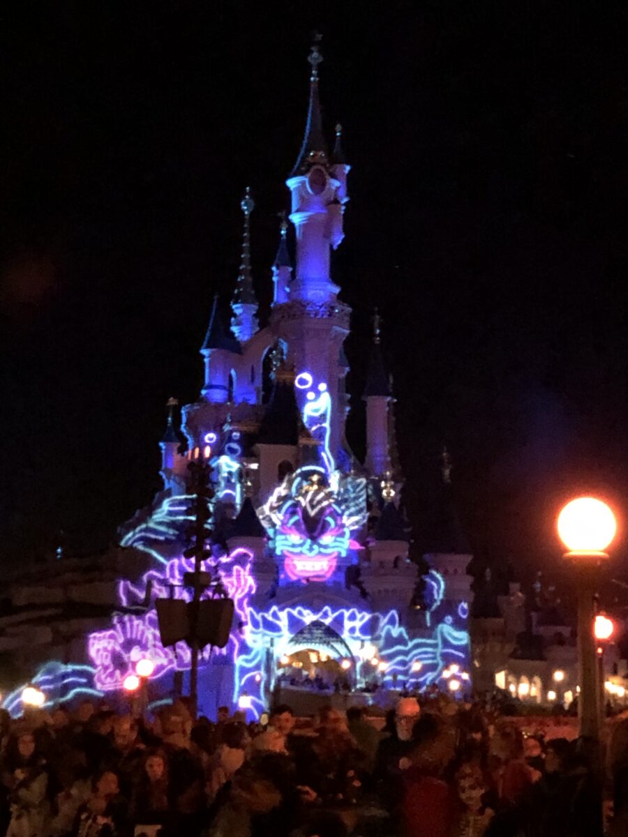 Disneyland Paris' Castle for Halloween with Ursula on it
